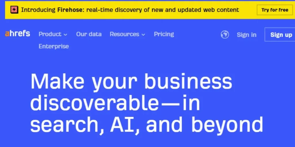 Official Ahrefs website screenshot featuring 'Everything you need to rank higher & get more traffic' and icons for Site Explorer, Keywords Explorer, and Site Audit